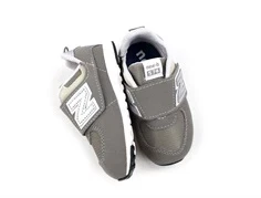 New Balance rain cloud/silver metallic 574 sneaker (bred)
